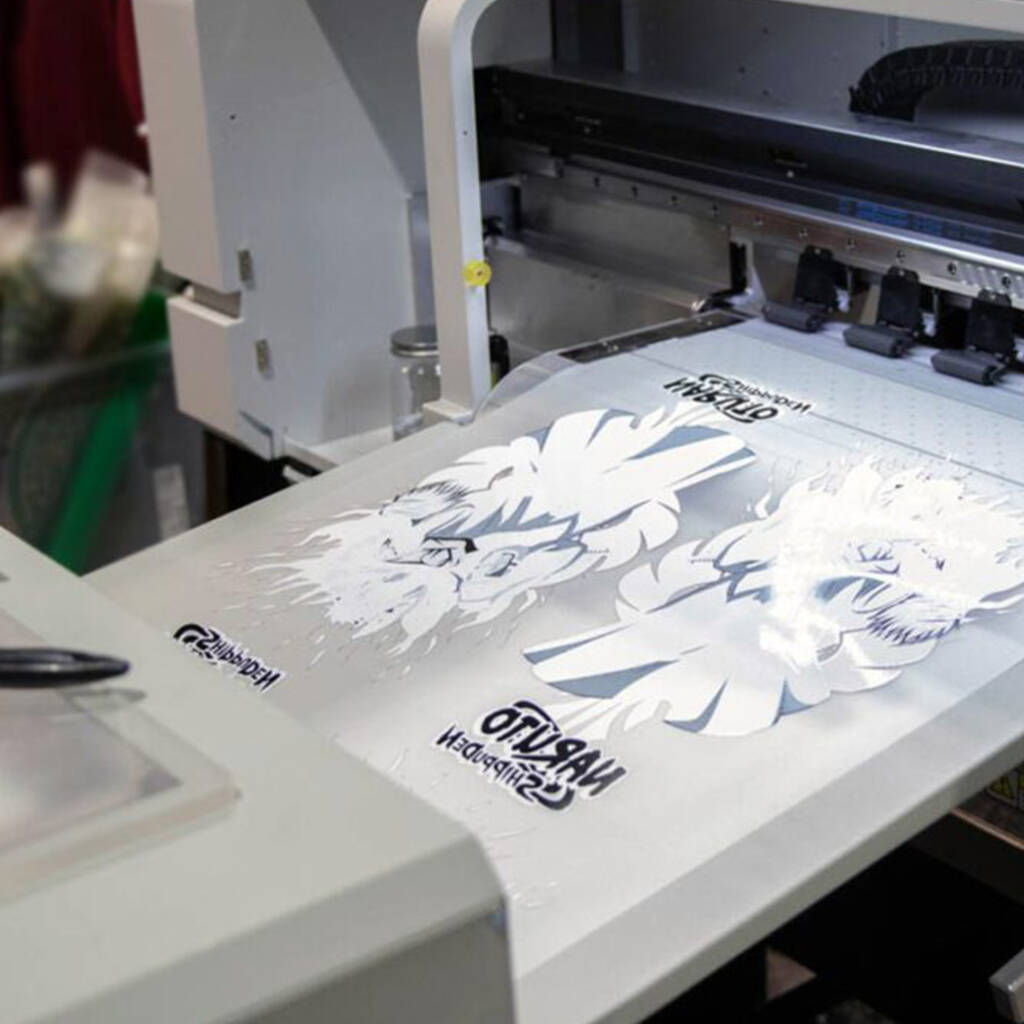 DTF printing machine producing high-quality transfers for boxing, MMA, BJJ, and fightwear apparel.