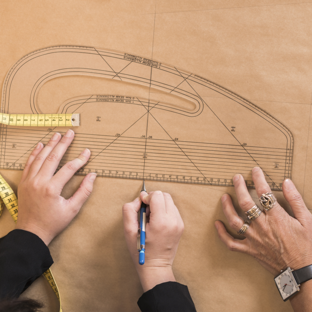 Precision pattern making and accurate sizing development for high-performance combat sports apparel.